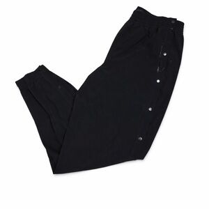 Woman’s Black Lululemon joggers Pants with snaps on the sides.